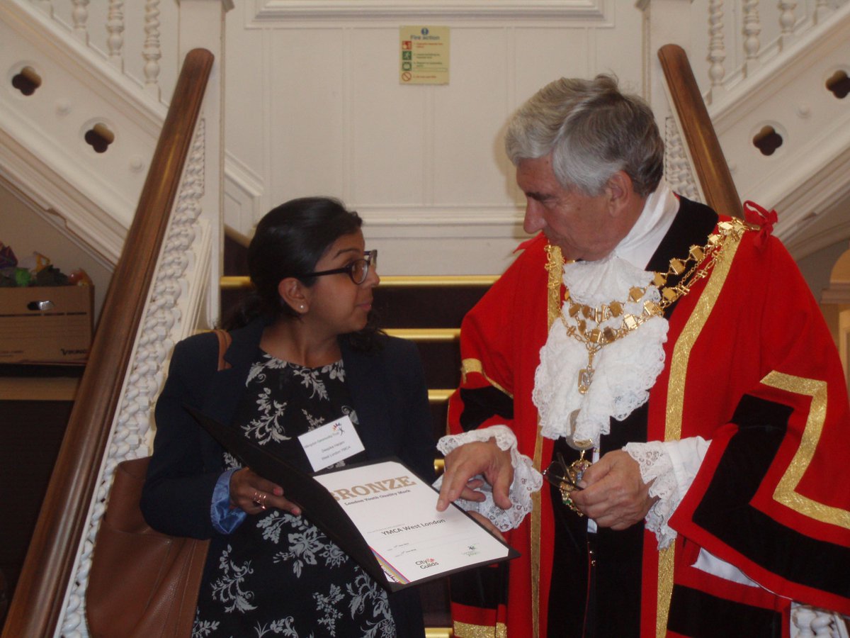 Mayor of Hillingdon presenting London Youth Bronze awards to Carole from Young Carers and Deepika West London YMCA