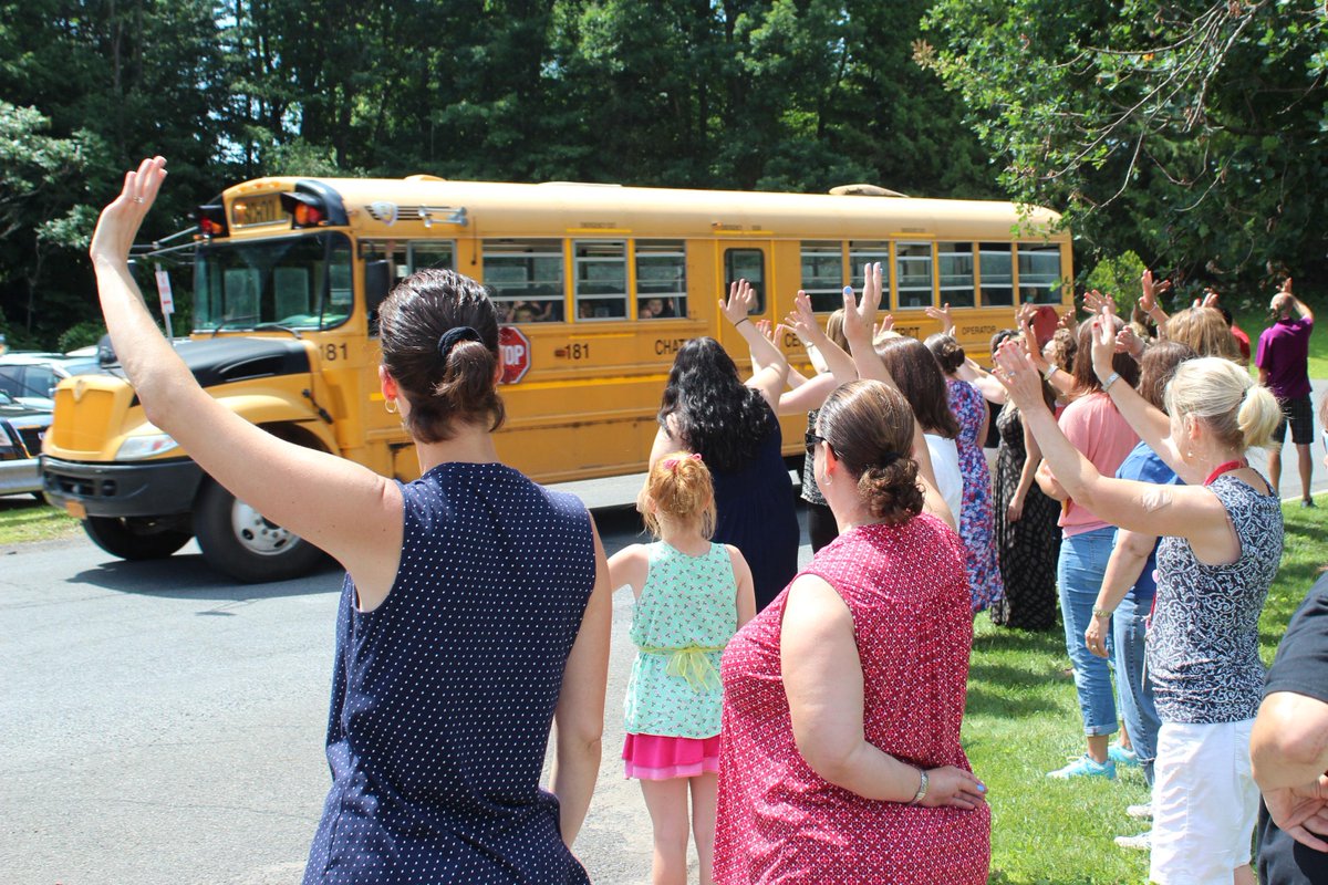 Faculty members wave goodbye as the buses bring students home for last time this year. Enjoy the summer!