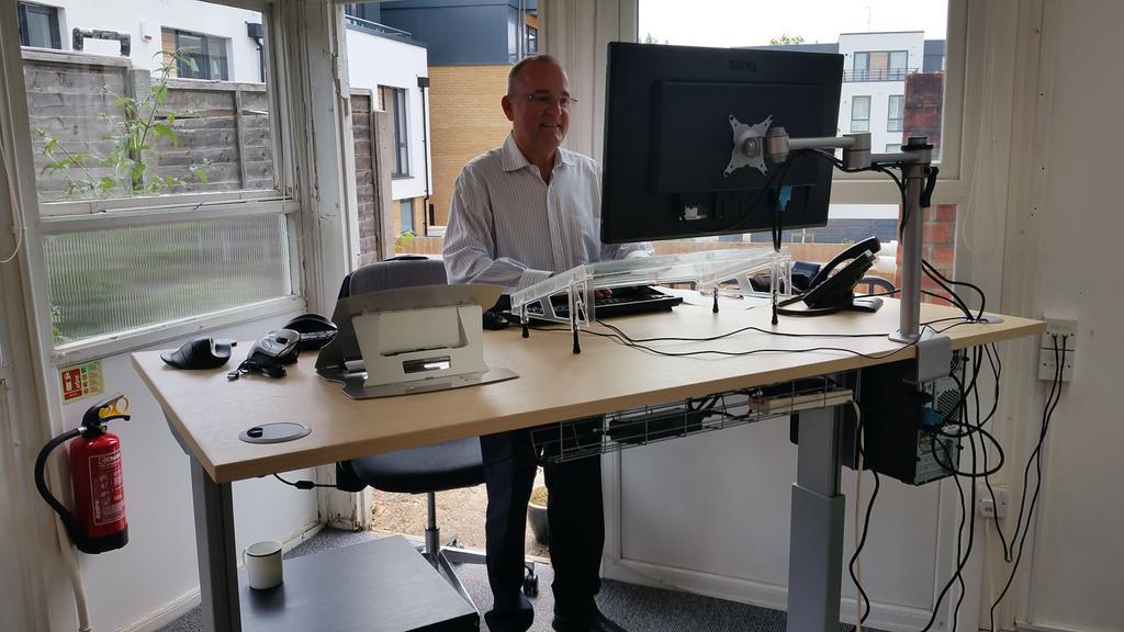 TherealBackCare's tweet photo. Stuart trying out his rise &amp; fall desk from @Orangebox_Ltd http://t.co/kzlyBl9AT1