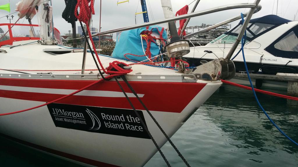YachtEllida's tweet photo. @RoundtheIsland #RTIR2015 #raceforall prep continues on #Ellida - stickers, spinnaker and @KempSails snuffer done! http://t.co/vRLMvmibiR