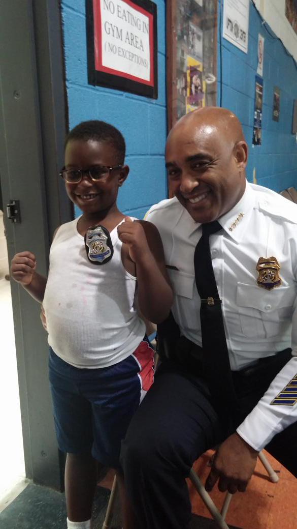 BaltimorePolice's tweet photo. #PCBatts take time to congratulate new detective. #communitypolicing http://t.co/Jh6MONyiqn
