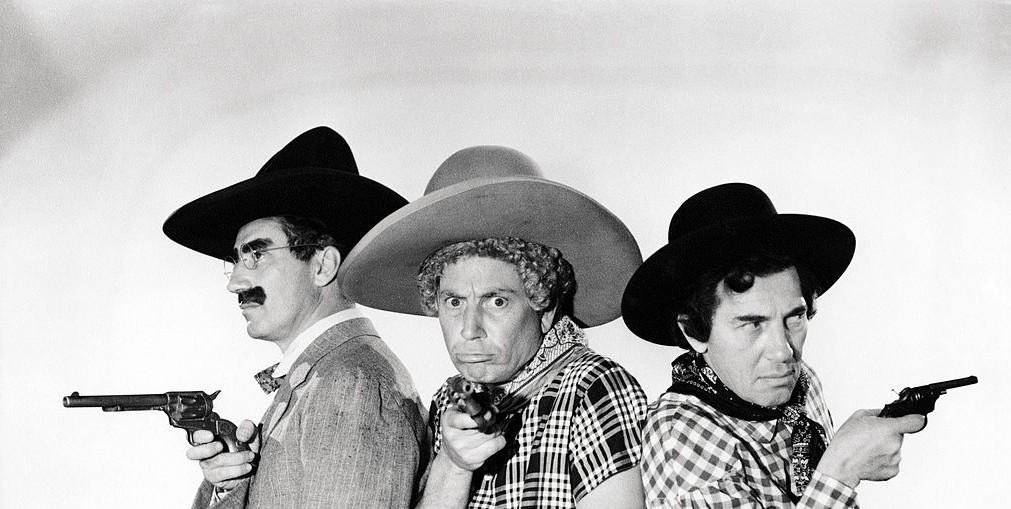 BrothersMWeb's tweet photo. The Marx Brothers pose holding toy pistols and wearing cowboy outfits, circa 1935. http://t.co/jtRSR6pQVf