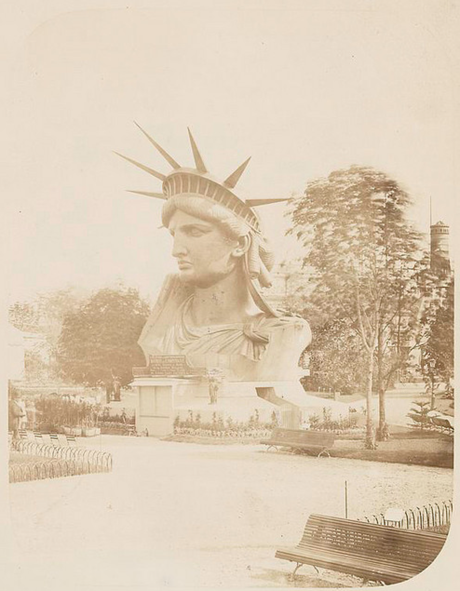 HistoryInPics's tweet photo. Head of the Statue of Liberty on display in a park in Paris, 1883. Photograph by Albert Fernique. http://t.co/Df9yaI6rFZ