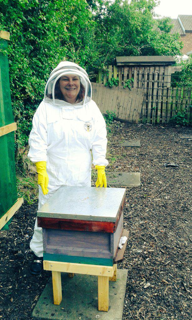AshbridgeHortic's tweet photo. Checking the school bees are happy in their new hive. http://t.co/PDrCIooHCl