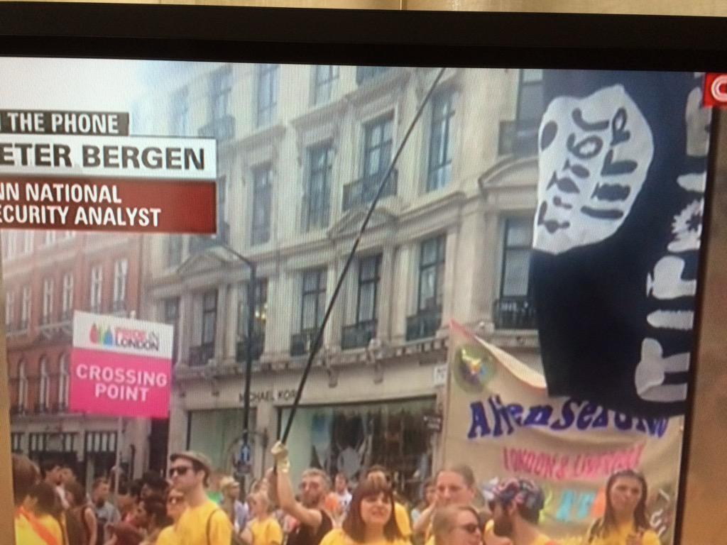DrGooseEcon's tweet photo. An "Isis flag" at the London Pride parade unnerves @CNN, who apparently don't recognize that the letters are dildos. http://t.co/DlF6Nyqzvy