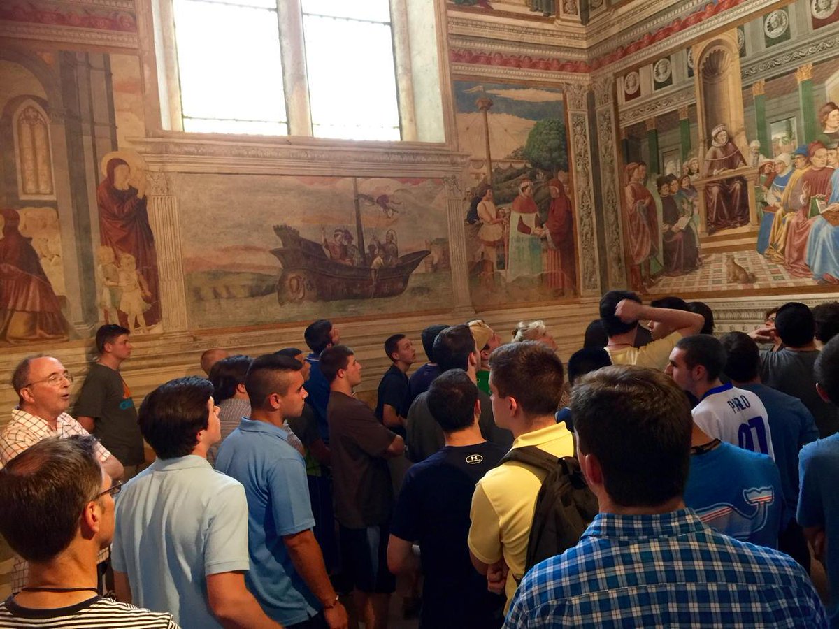 Fr. Lowery giving a lesson about St. Augustine using the church frescoes.  #xpi