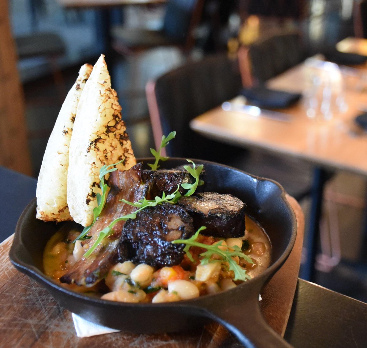 #comidarapida lunch for this week - #morcilla (#Spanish #bloodsausage), white beans + bacon w/ a glass of wine - $20!