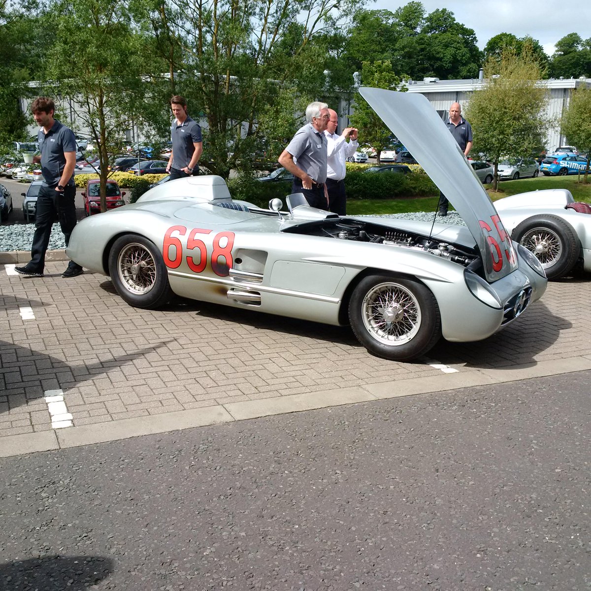 MercedesAMGF1's tweet image. History, right in front of our very eyes... the legendary 300 SLR #658 as driven by #Fangio in the 1955 #MilleMiglia!