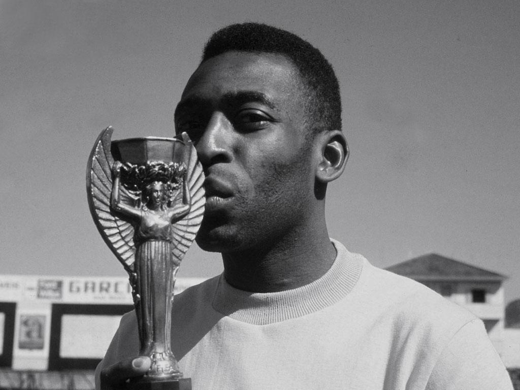 CoolOldSchool's tweet photo. 17-year-old Pele with the World Cup, which he helped Brazil win today in 1958. http://t.co/3nGXymd5aN
