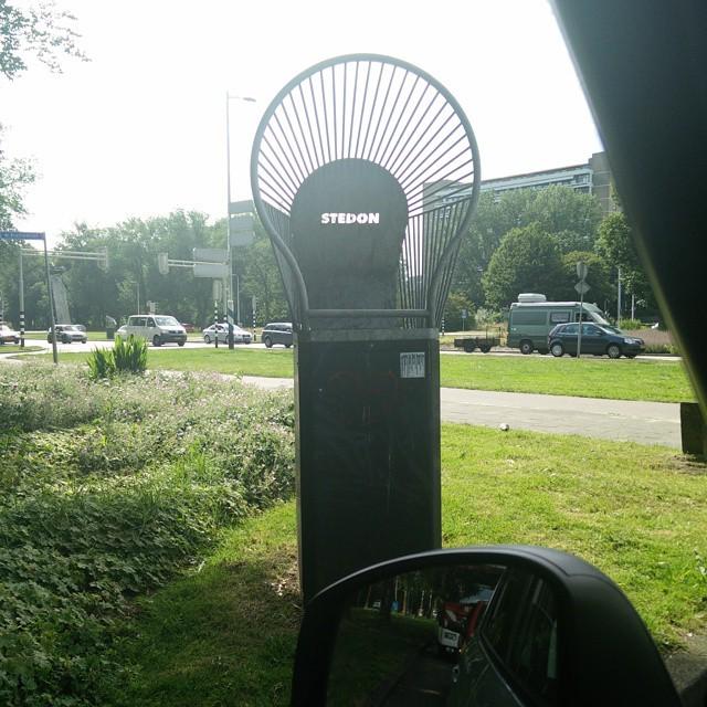 hhp's tweet photo. Goddamn genius Europeans and their roadside trashcans that have a net to catch your poorly… http://t.co/4UA5NwvJSD http://t.co/KUHW8LegU7