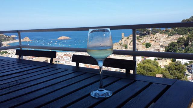spanish_wl's tweet photo. Kathryn's lovely #SWLsummer in Tossa de Mar (Costa Brava) enjoying a glass of xarel.lo with a view Wow! @StompingGirl http://t.co/cSvWZgMSMf