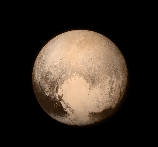 mashable's tweet image. The clearest photo of Pluto yet reveals striking details (look at its heart!)  on.mash.to/1O9vH1x