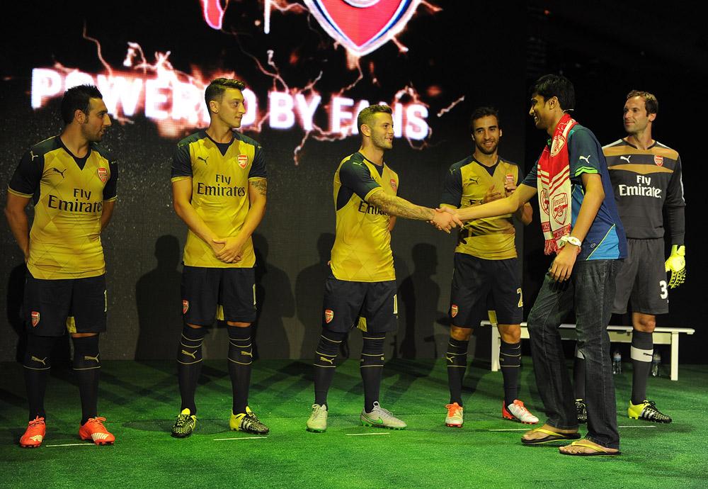 Arsenal's tweet photo. PICTURES: @Arsenal squad launch new away kit in Singapore. See more here: http://t.co/OBgJgUMru1 http://t.co/kXOIgd8SRS