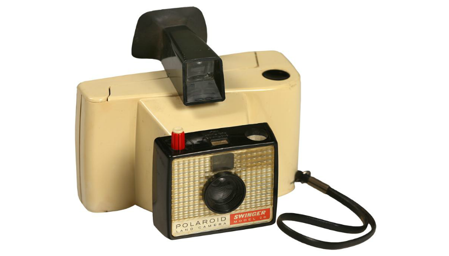 Polaroid's tweet photo. “It’s more than a camera / It’s almost alive.” Happy 50th to the Polaroid Swinger! 🎊 🎂 🎉http://t.co/wX0qJA3ZVB http://t.co/srmYdFxBQP