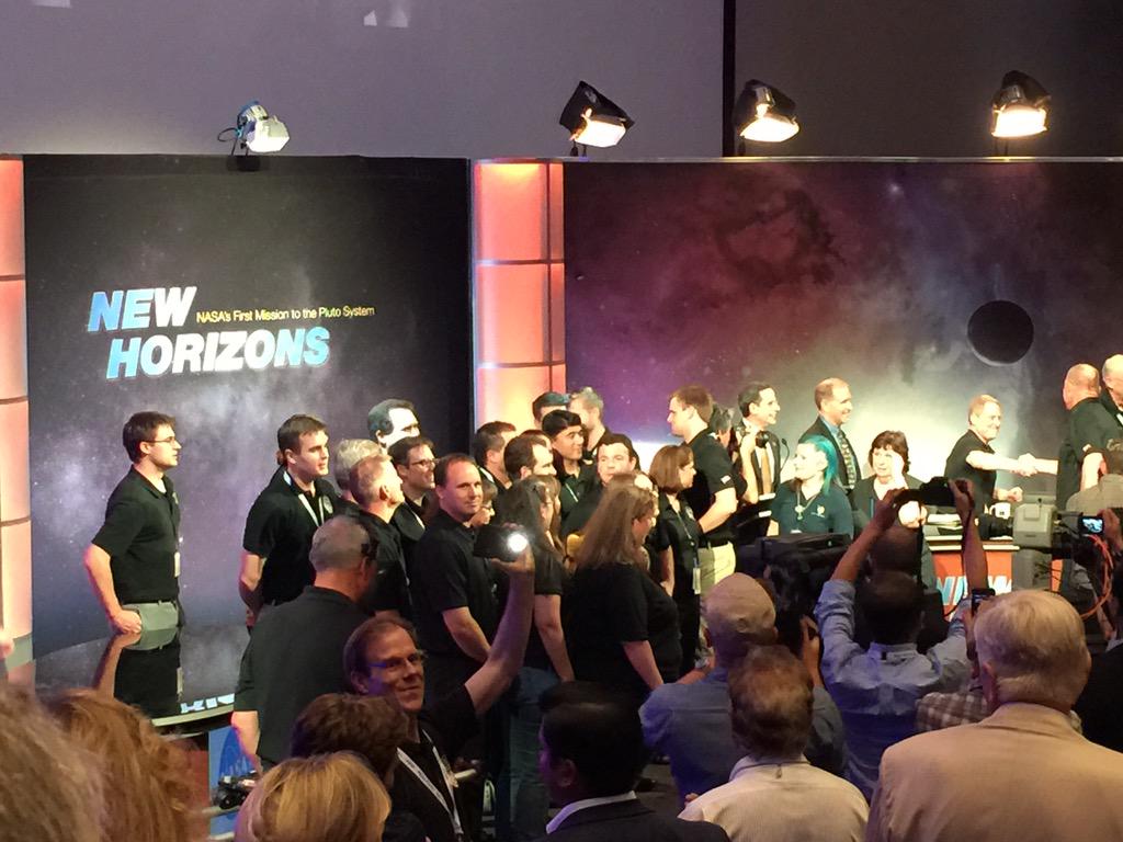 ChristineHFox's tweet photo. The New Horizons team gets a well-deserved standing ovation! http://t.co/S3vucLQOlw