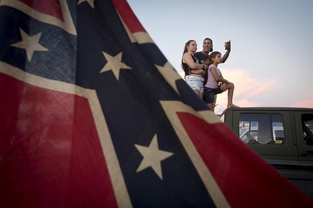 INTERESTING_JPG's tweet photo. A group of people standing around a red and white boat . http://t.co/aGCFmD9ygU
