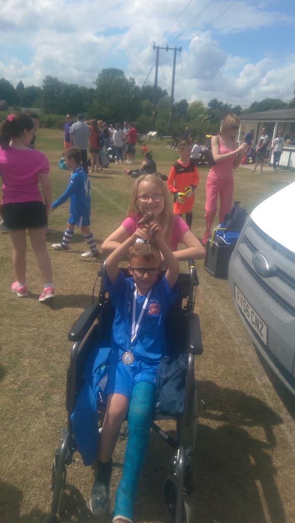 Lichfield u7s winning team, and Corey with his medal