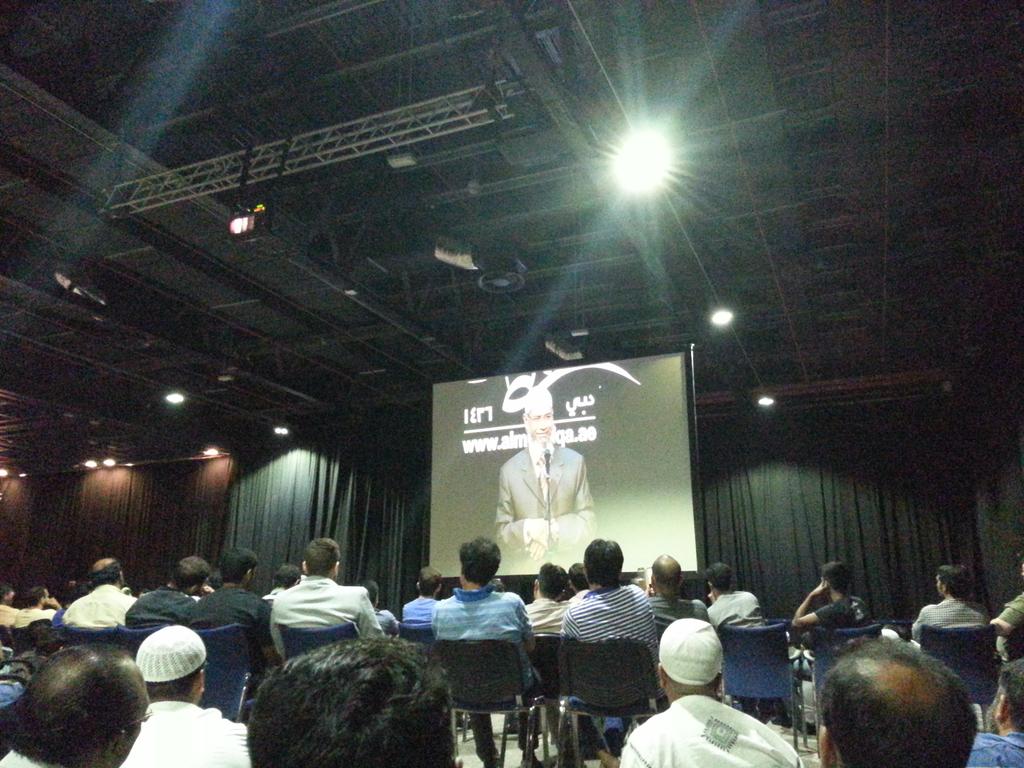 . <a href="/zakirnaikirf/">Dr Zakir Naik</a> is on stage now speaking to a packed hall. #RamadanForum
