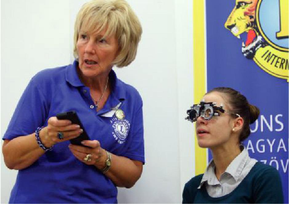 isaame2015's tweet photo. District 119 Dr. Klara Kery, a Gyor First Lion, screens a patient. http://t.co/an1r0ldfHO