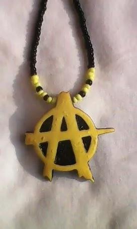 Afriworks's tweet photo. Anarchist necklace made for a friend and can be designed in any color http://t.co/JP4dlI46FO