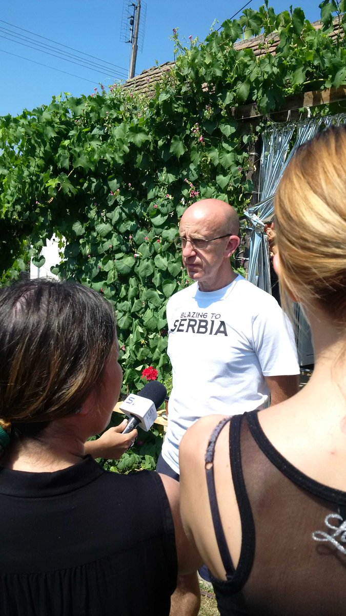BlazingToSerbia's tweet photo. Steve from @SWFireandRescue being interviewed for TV at one of the houses that @BlazingToSerbia refurbished http://t.co/KMdsXfIRR2