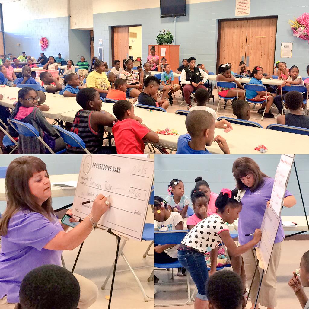 100 energized youths and 1 giant check! Learning how to write a check &amp; balance a checkbook! Thanks #ProgressiveBank