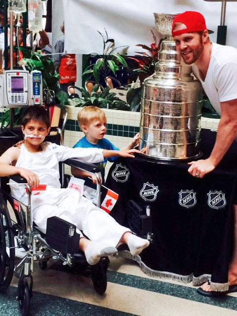NHL's tweet photo. During his day with the #StanleyCup, @bbicks29 brought Stanley to Sick Kids Hospital in Toronto. (Photo via HHOF) http://t.co/WlrSLbDOju