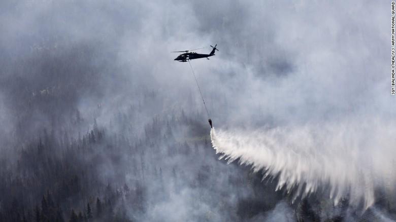 CNN's tweet photo. 3.1 million acres have burned in #Alaska, the state says, as it sweats one very hot summer: http://t.co/2LeQU1968m http://t.co/2eUYL9sdun