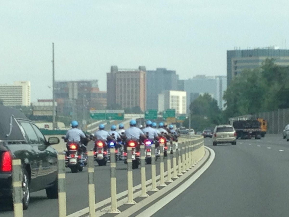 JulieNiemela's tweet photo. Police escort for #CarlosSilva #Brazil investigator killed in #WPFG bicycle accident - quite a nice tribute. http://t.co/SIcXVnRura