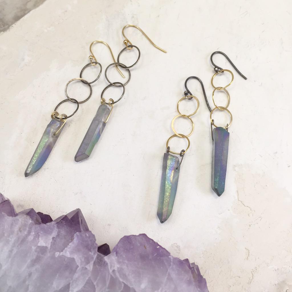 SilverPenniesJ's tweet photo. Titanium quartz crystals dangle like petite blue flames from interlocking circles of sterling &amp; gold. #morgantown #wv http://t.co/osuYJhABjT
