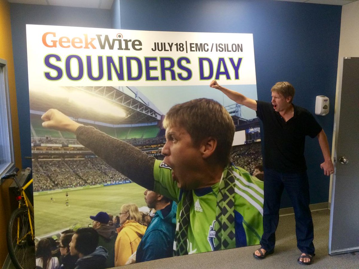 geekwire's tweet photo. GeekWire’s @johnhcook warms up for Sounders Day. Join us! http://t.co/OypfMQe8qr (Tnx to @Comm_Dis for giant sign) http://t.co/Ljrgvq0r0U