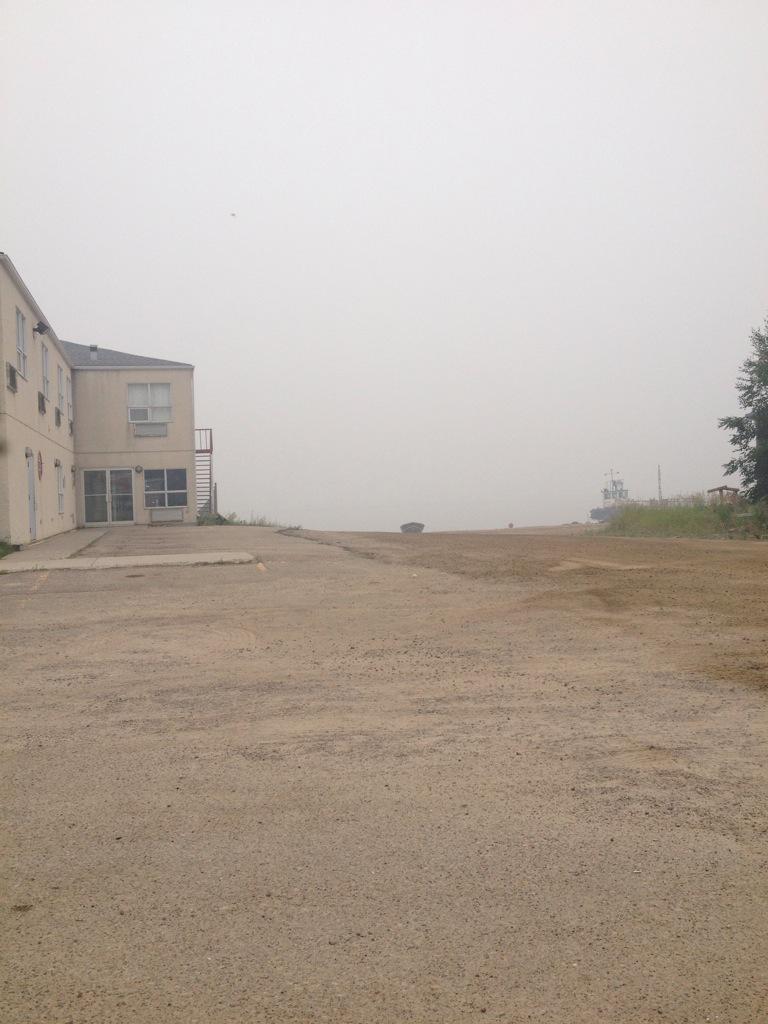 gripperman_g's tweet photo. Our view of the lake from sector 4 staging area. No wind and it's humid. #saskwildfires #bwfd http://t.co/DIjyl21XCy