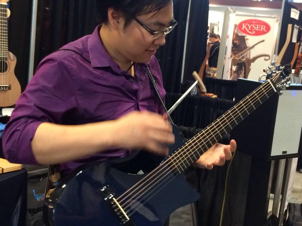 the_engle's tweet photo. @ShelteredTurtle playing a little Engle at #NAMM!! http://t.co/0V2v68vHpa
