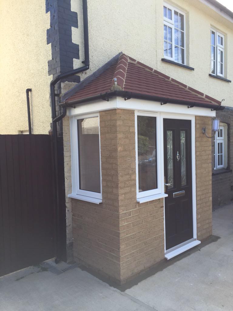 Porch built and installed by Taylorglaze in #upshire white uPVC windows with a lovely black composite door.