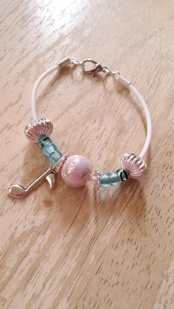 Lynnsgr8byz's tweet photo. White rubber cord bracelet, blue glass beads, pink http://t.co/xHJRcf1Zso  #madeinUSA #hqteam http://t.co/VUS2MpxLiI