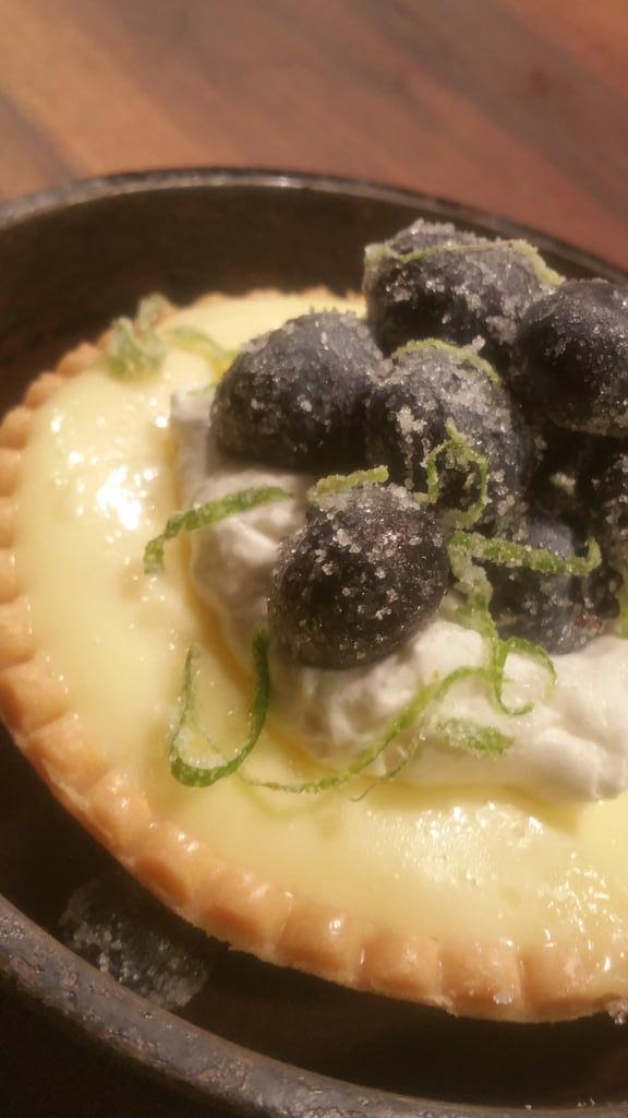 cheflady88's tweet photo. Lemon curdtart, creme fraiche whipped cream, lime candied blueberries @tastebarSTL http://t.co/5IgvN2HanA