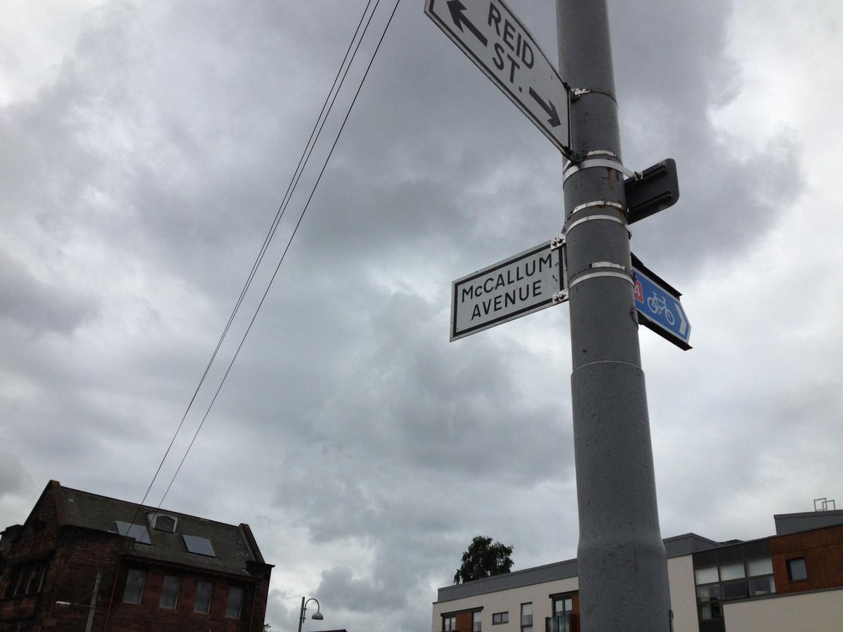 Police remain at McCallum Avenue in Rutherglen where a man's body was