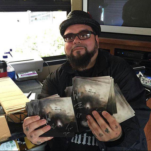 POD's tweet photo. Signing the booklets for our new album #TheAwkening! http://t.co/H9IZHDVj7k http://t.co/LKU9bMSEAn