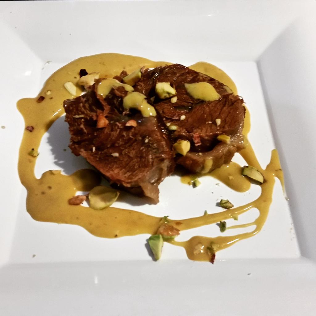 JeffInHouseChef's tweet photo. Pork cheek with mango basil sauce and pistachios. #farmtotable #wyebrookfarm #testkitchen http://t.co/panc6W6Su9