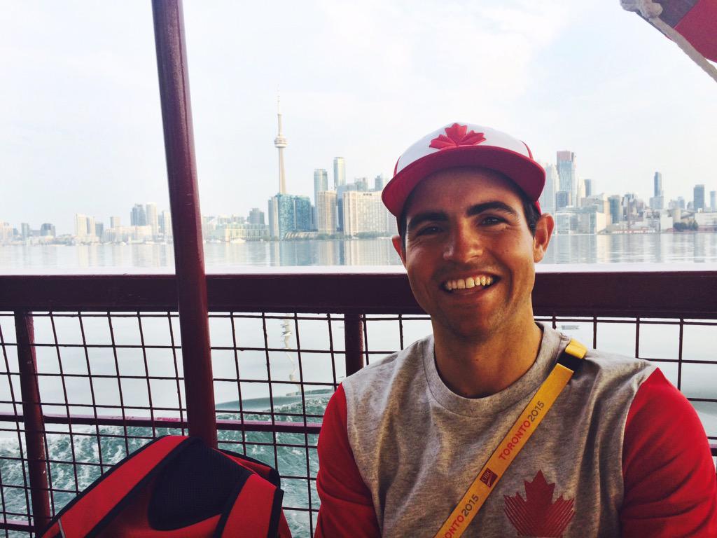PanSail's tweet image. Canadian Sunfish sailor @sailluke is all smiles on the way to @rcyctoronto for the first day! #TO2015 #TeamCAN