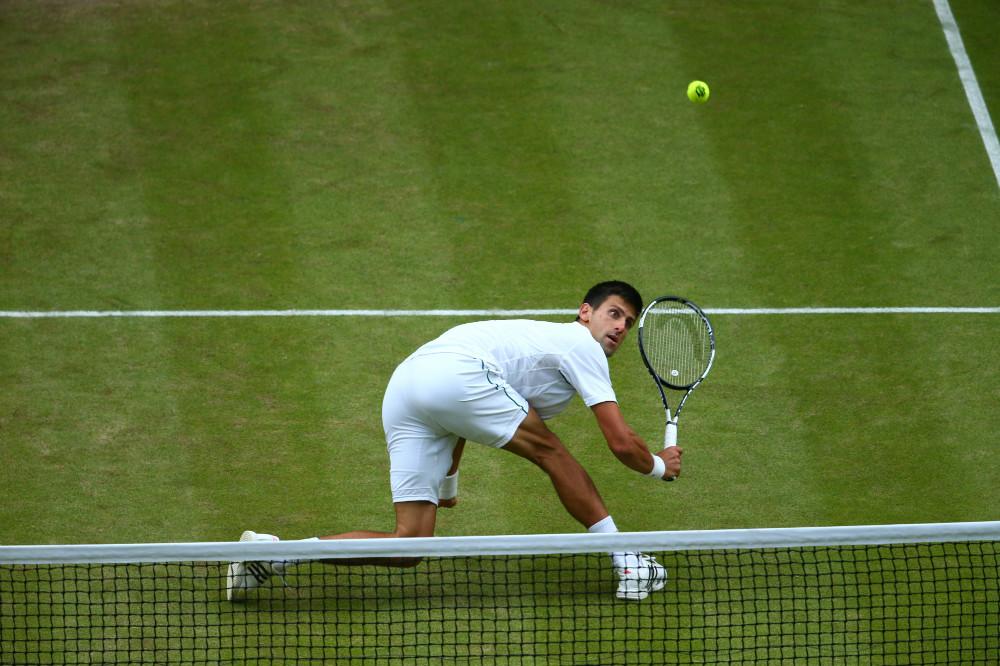 Wimbledon's tweet photo. Federer has an opening at 0-30, but Djokovic battles back to hold. The Swiss will serve to keep #Wim8ledon alive http://t.co/jBwmipkwuI