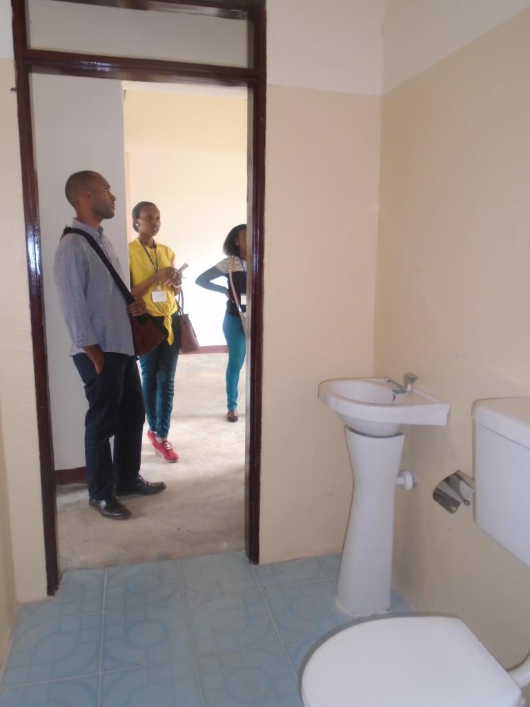 thetownbuild's tweet photo. @PeaceCorps volunteer #Aaron tours the interior spaces of the @thetownbuild #lowcostHouse http://t.co/4BHPpmmG8Z