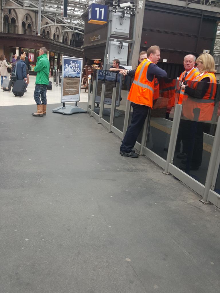 grumwsmith's tweet photo. @ScotRail Yes. Why are there at least 5 staff standing around at GLC gabbing whilst only 1 person selling tickets? http://t.co/ewGeapECCs