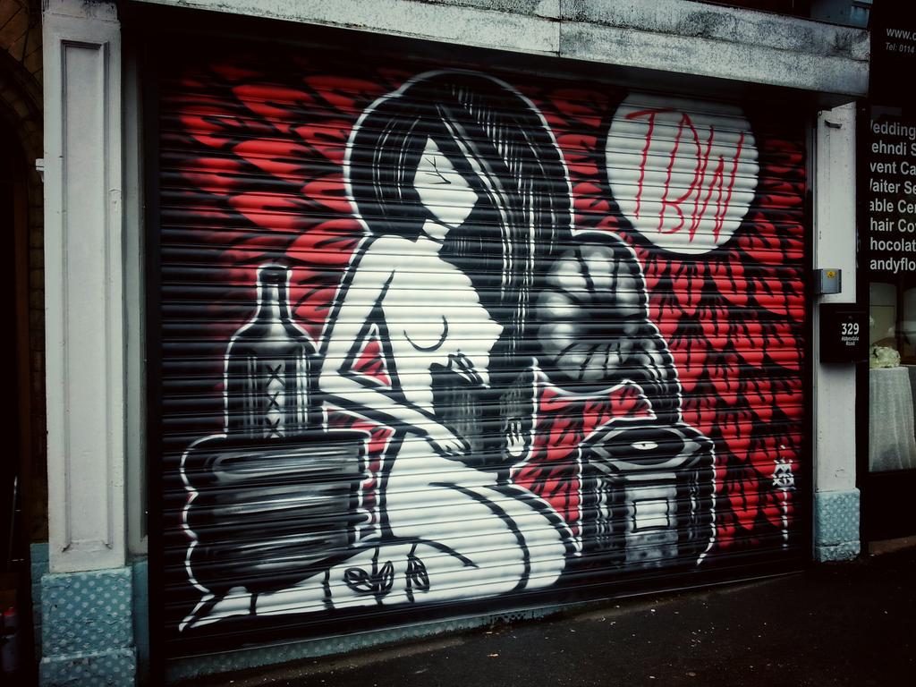 Coloquix's tweet image. Painted some shutters in the rain. The Besotted Wretch opens on the first. #coloquix #streetart #graffiti #sheffield