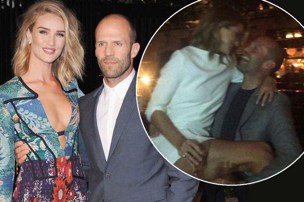 . wishes Jason Statham a happy birthday by jumping into his lap during drinks:
 