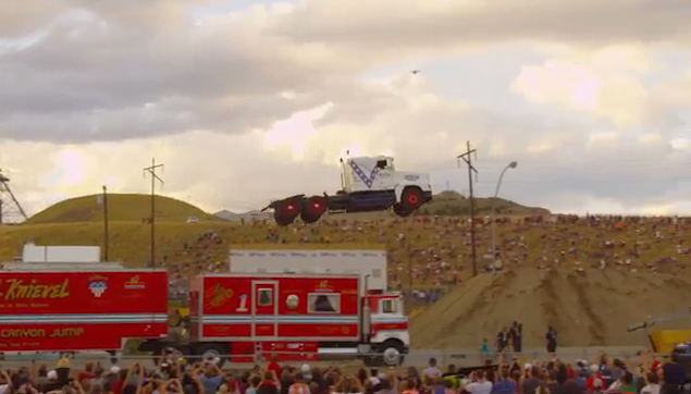 verge's tweet photo. Watch a semi truck fly a record-breaking 166 feet through the air http://t.co/3rl6oWwiOj http://t.co/EvavPV0jre