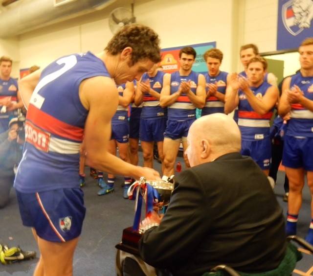 RobertRoseFdn's tweet photo. Director Cliff Wise presenting the @westernbulldogs with the Robert Rose Cup after Sunday's game v @CollingwoodFC http://t.co/y1zvJ2RQUN