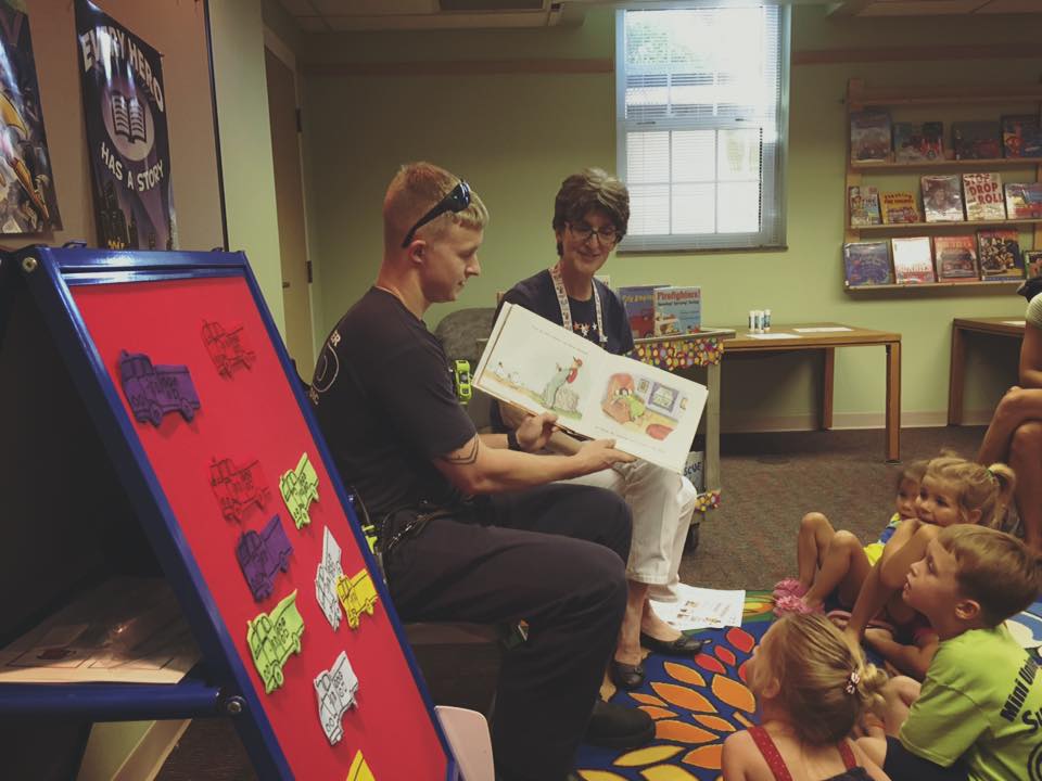 IAFFLocal1235's tweet photo. Probabionary Firefighter @guygoodpaster doing a little reading to the kids at the Library. #KeepReadingKids http://t.co/6ZLtBXjx3c