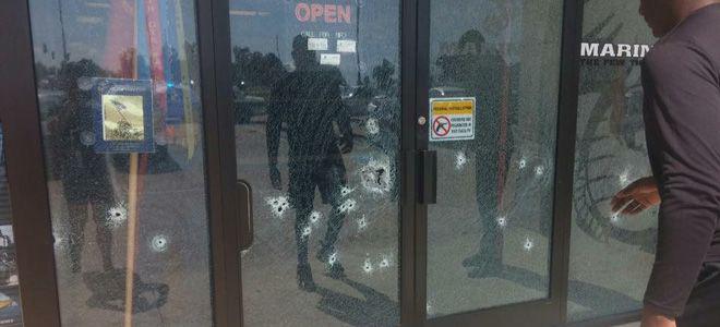 Bullet holes surround gun free zone sticker in Chattanooga