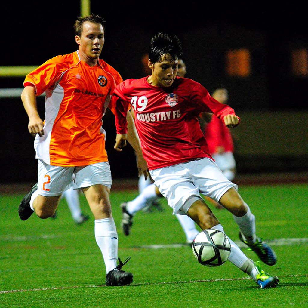 TmesisFC's tweet photo. #IndustryFC player out maneuvers @lawolvesfc winger Duncan Cappriatti. #LAWolvesFC #lawolves http://t.co/AoEZPXr6JA